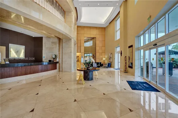 a view of park with slide and potted plants