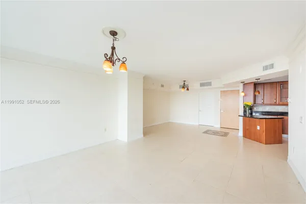 a kitchen with stainless steel appliances granite countertop a sink a stove cabinets and a refrigerator