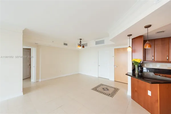a view of a kitchen with a sink stove and hallway