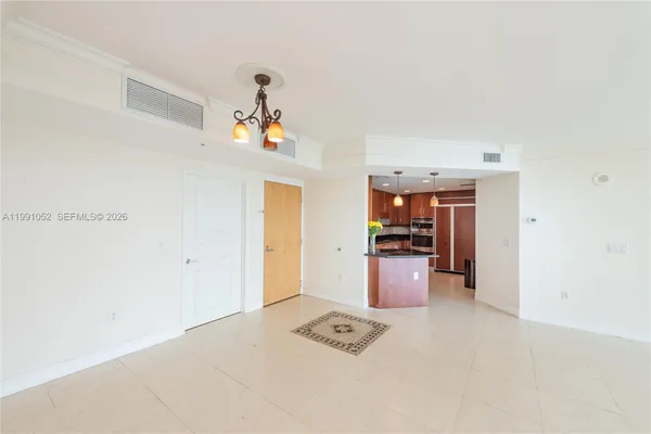 a kitchen with granite countertop a sink and cabinets