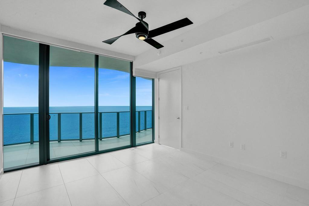 900 North Ocean Boulevard, Unit 1405 Pompano Beach, FL 33062 - Photo 23 of 59 an empty room with ceiling fan