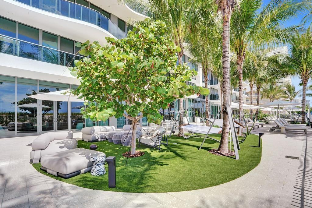 900 North Ocean Boulevard, Unit 1405 Pompano Beach, FL 33062 - Photo 50 of 59 front view of a house with a yard