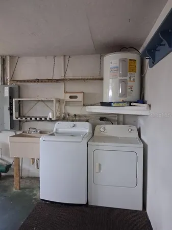 a kitchen with a stove top oven sink and cabinets