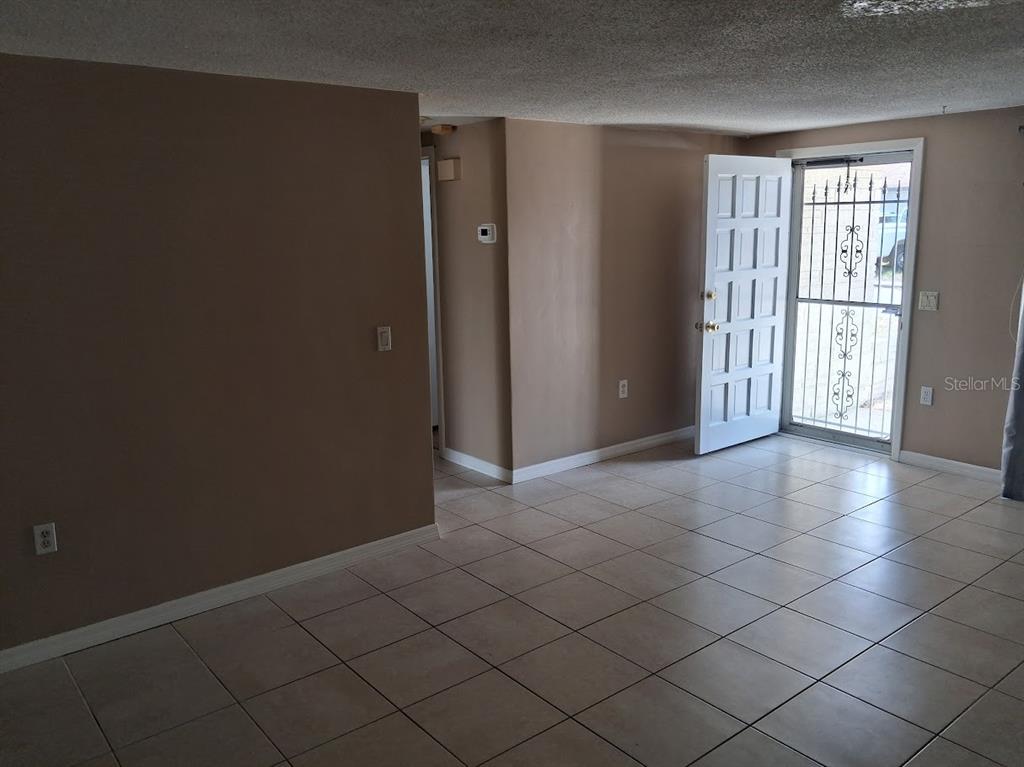 6821 Mesa Verde Street Port Richey, FL 34668 - Photo 2 of 19 an empty room with windows