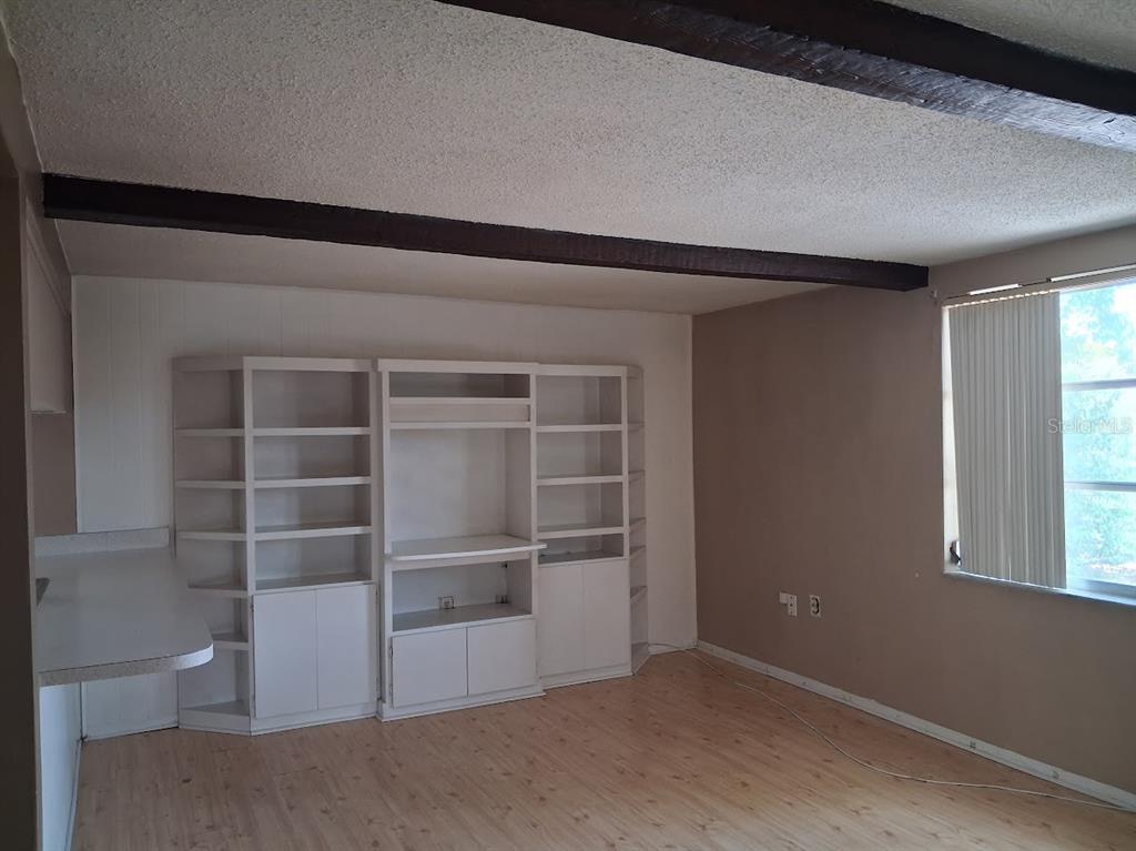 6821 Mesa Verde Street Port Richey, FL 34668 - Photo 7 of 19 a view of an empty room with a window
