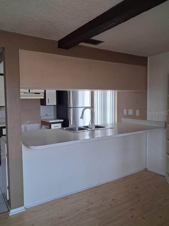 6821 Mesa Verde Street Port Richey, FL 34668 - Photo 8 of 19 a view of a kitchen with furniture and a window