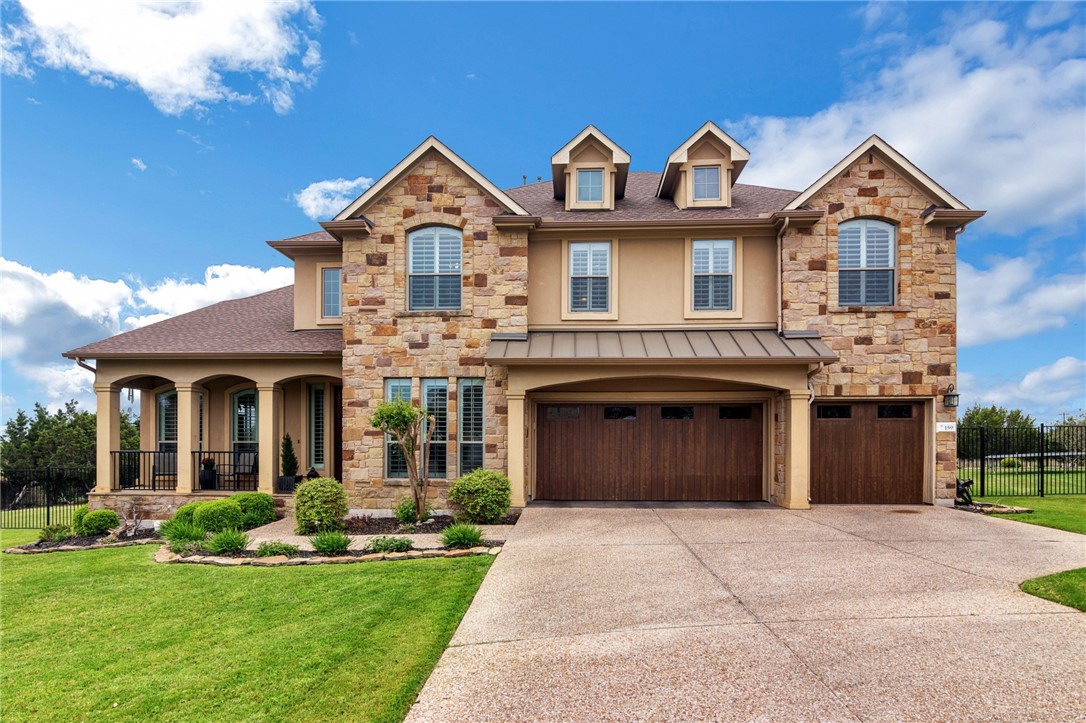 159 Tanager Circle Austin, TX 78737 - Photo 1 of 1 a front view of a house with a yard and garage