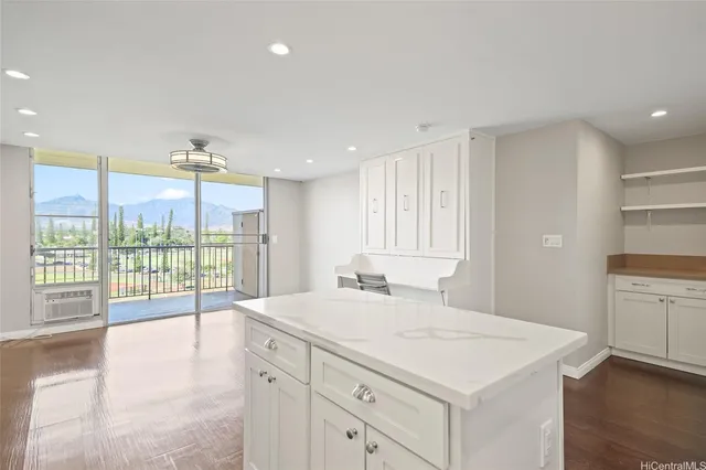 a spacious bathroom with a granite countertop sink and a large window