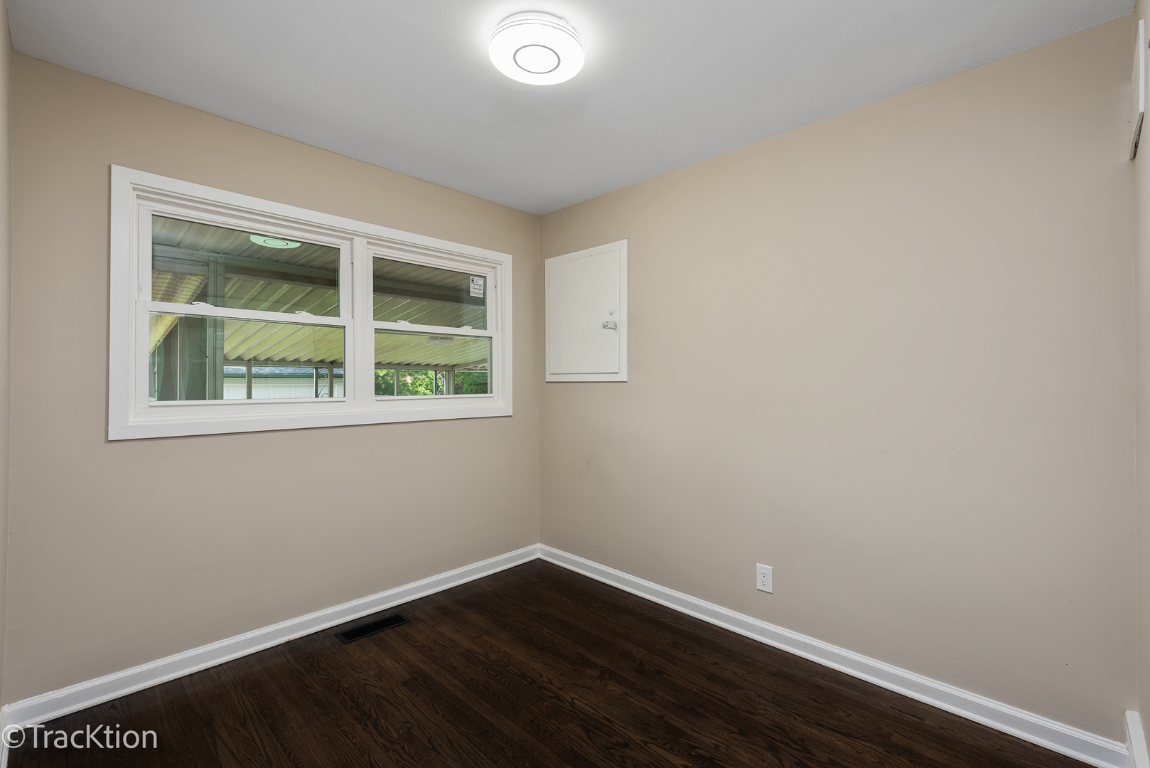 1824 Evergreen Road Homewood, IL 60430 - Photo 9 of 19 a view of an empty room with wooden floor and a window