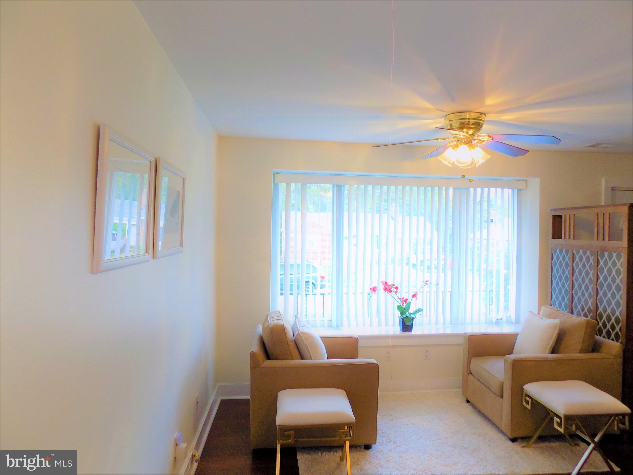 2419 Darrow Street Silver Spring, MD 20902 - Photo 5 of 33 a living room with furniture and a large window