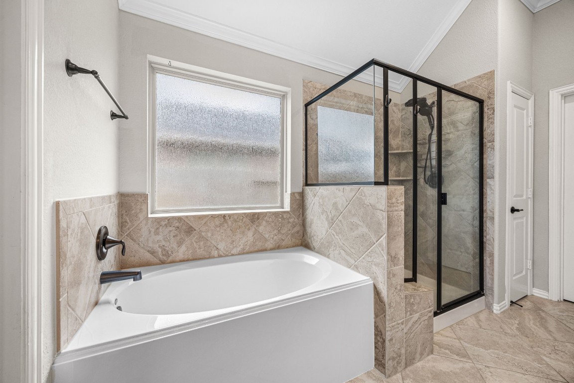 31521 Timber Grove Lane Spring, TX 77386 - Photo 18 of 30 Primary bath offers both a soaking tub and a walk-in shower.