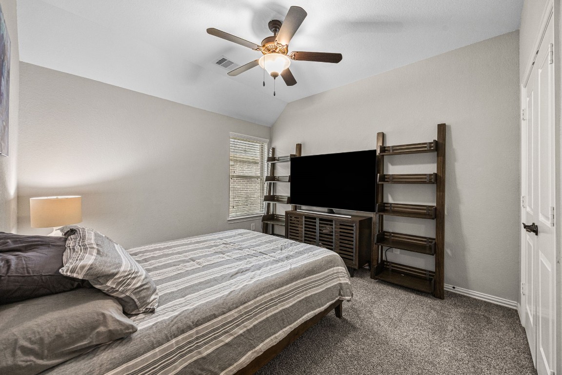 31521 Timber Grove Lane Spring, TX 77386 - Photo 21 of 30 Cozy bedroom featuring a large window for natural light. The walls are painted a neutral color, enhancing the room's airy feel.