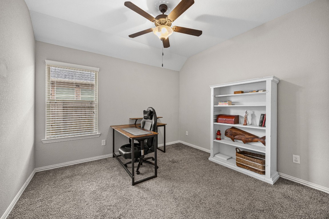 31521 Timber Grove Lane Spring, TX 77386 - Photo 22 of 30 This versatile room boasts vaulted ceilings and plush carpeting, perfect for a bedroom, office, or hobby space.