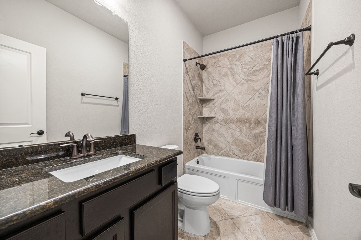 31521 Timber Grove Lane Spring, TX 77386 - Photo 23 of 30 An additional full bathroom provides easy access for bedrooms or visiting guests.