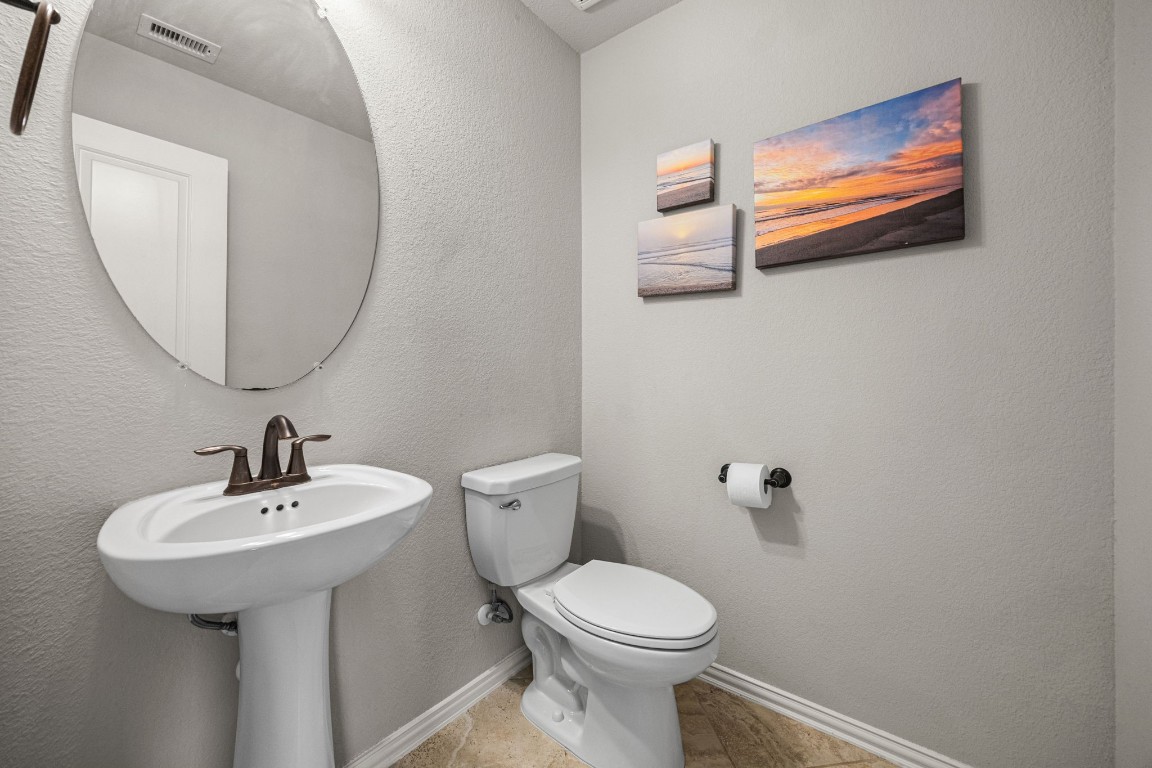 31521 Timber Grove Lane Spring, TX 77386 - Photo 25 of 30 A conveniently placed half bath sits just off the game room for easy access.