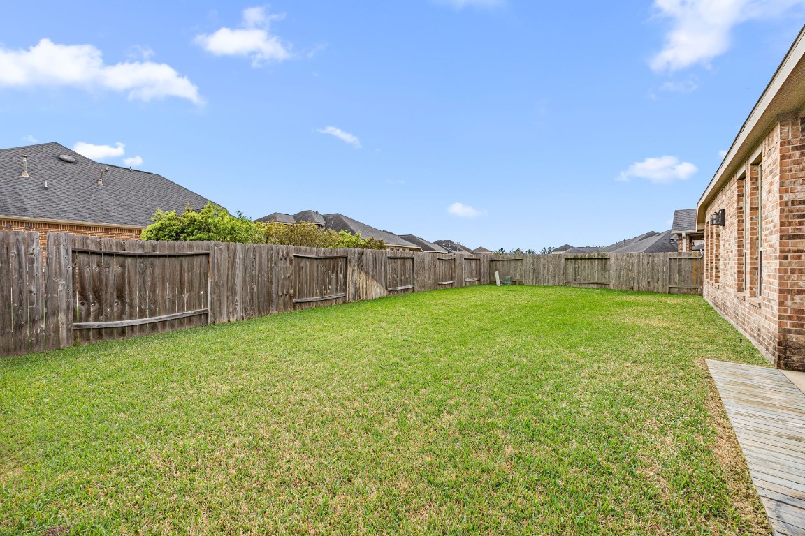 31521 Timber Grove Lane Spring, TX 77386 - Photo 28 of 30 The backyard offers plenty of space for a variety of activities