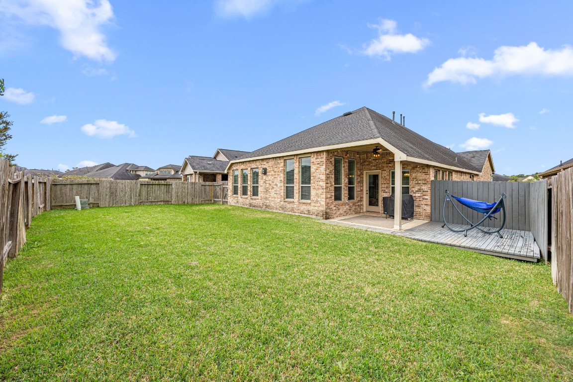 31521 Timber Grove Lane Spring, TX 77386 - Photo 29 of 30 Enjoy outdoor living with a covered patio and an extended patio for additional space.