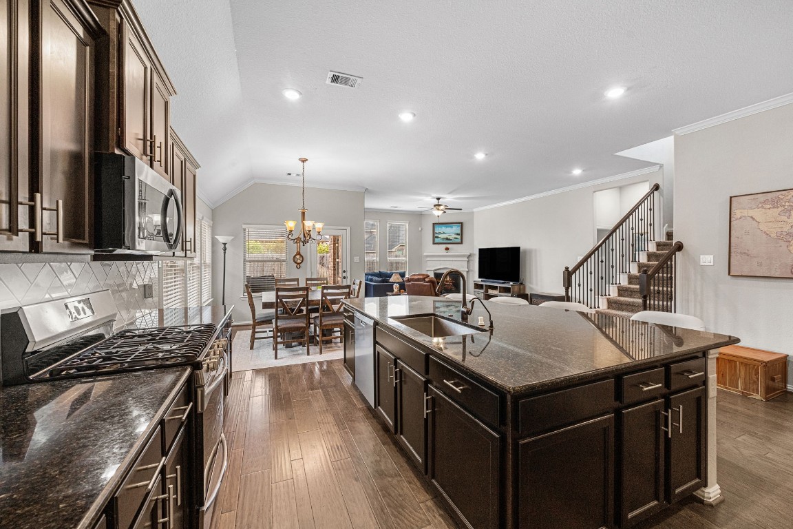 31521 Timber Grove Lane Spring, TX 77386 - Photo 10 of 30 Stay connected to the action from this open, centrally located kitchen.