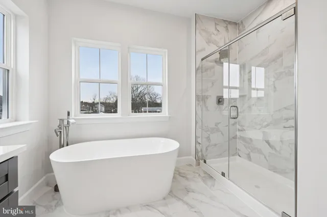 a bathroom with double vanity sink and a mirror