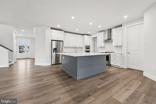 a view of kitchen with wooden floor