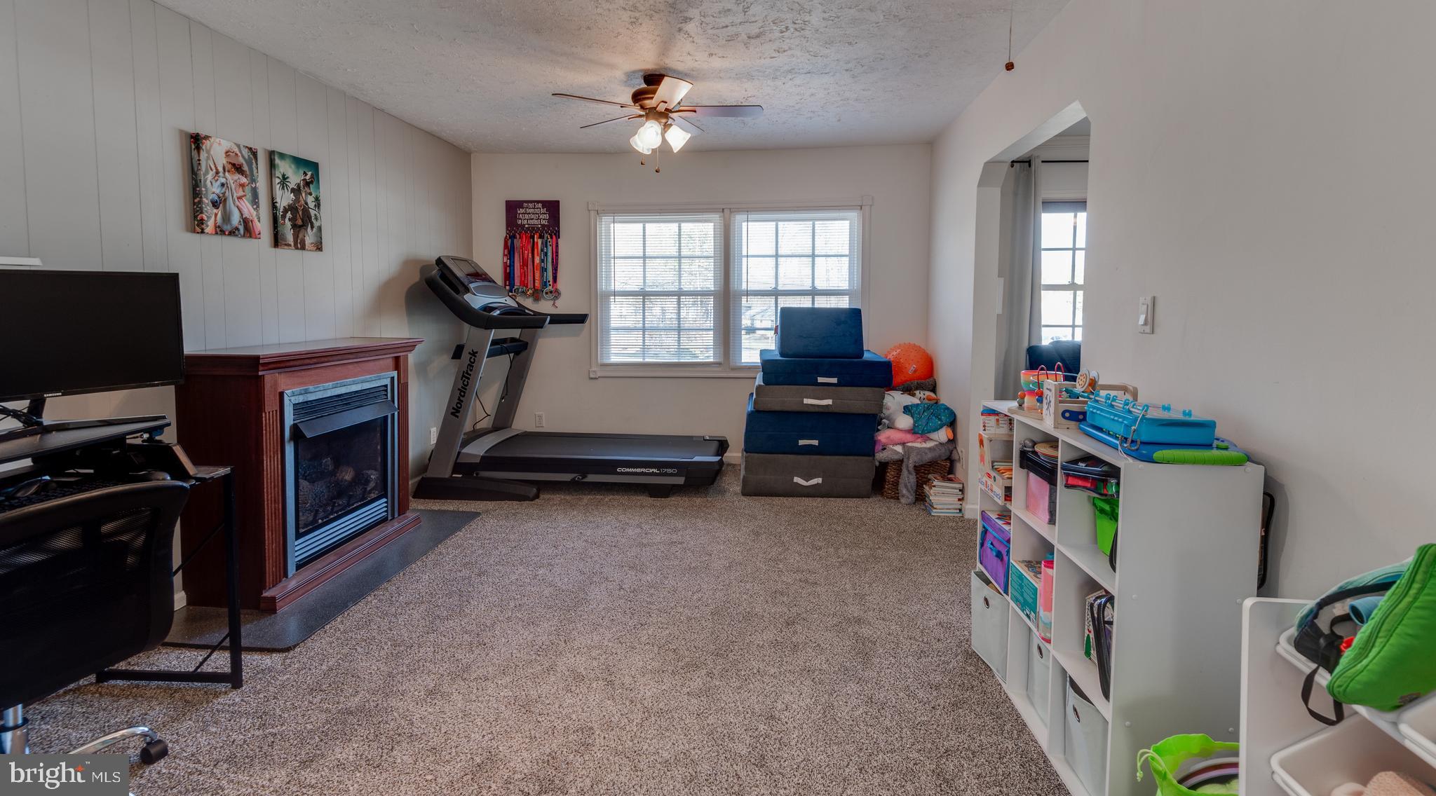 44125 Louisdale Road California, MD 20619 - Photo 12 of 44 a room with furniture a flat screen tv and a window