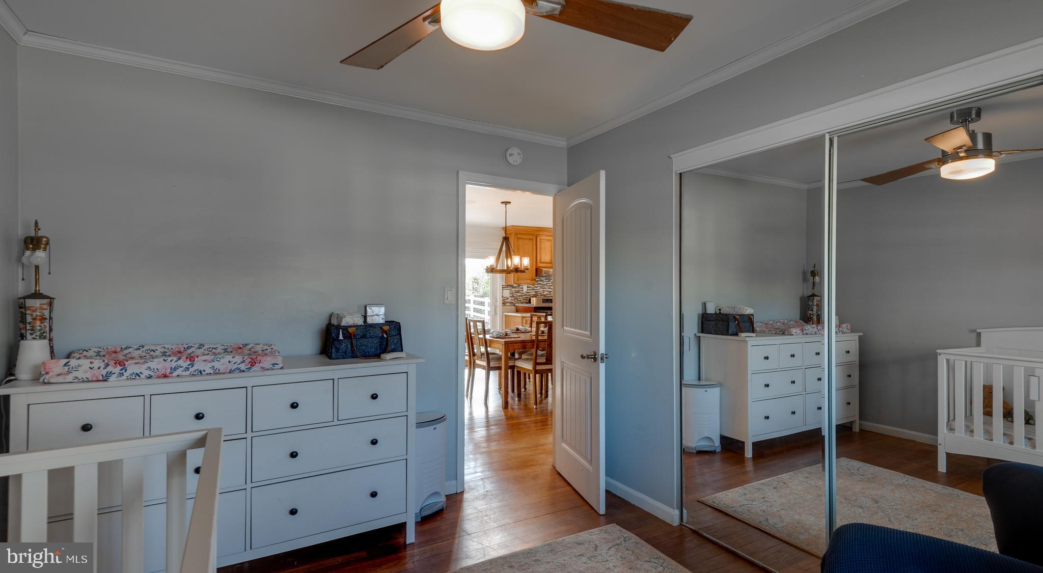 44125 Louisdale Road California, MD 20619 - Photo 16 of 44 a hallway with cabinets and wooden floor