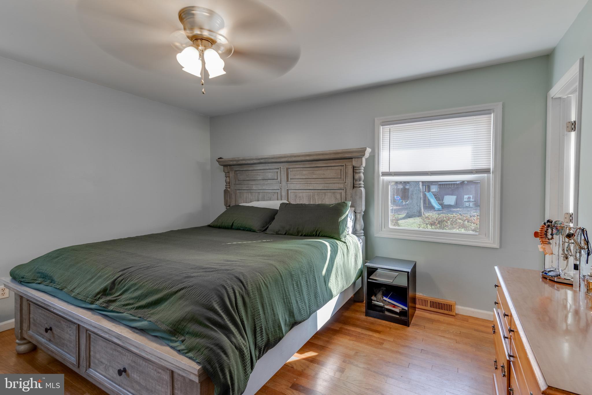 44125 Louisdale Road California, MD 20619 - Photo 17 of 44 a bed sitting in a bedroom next to a window