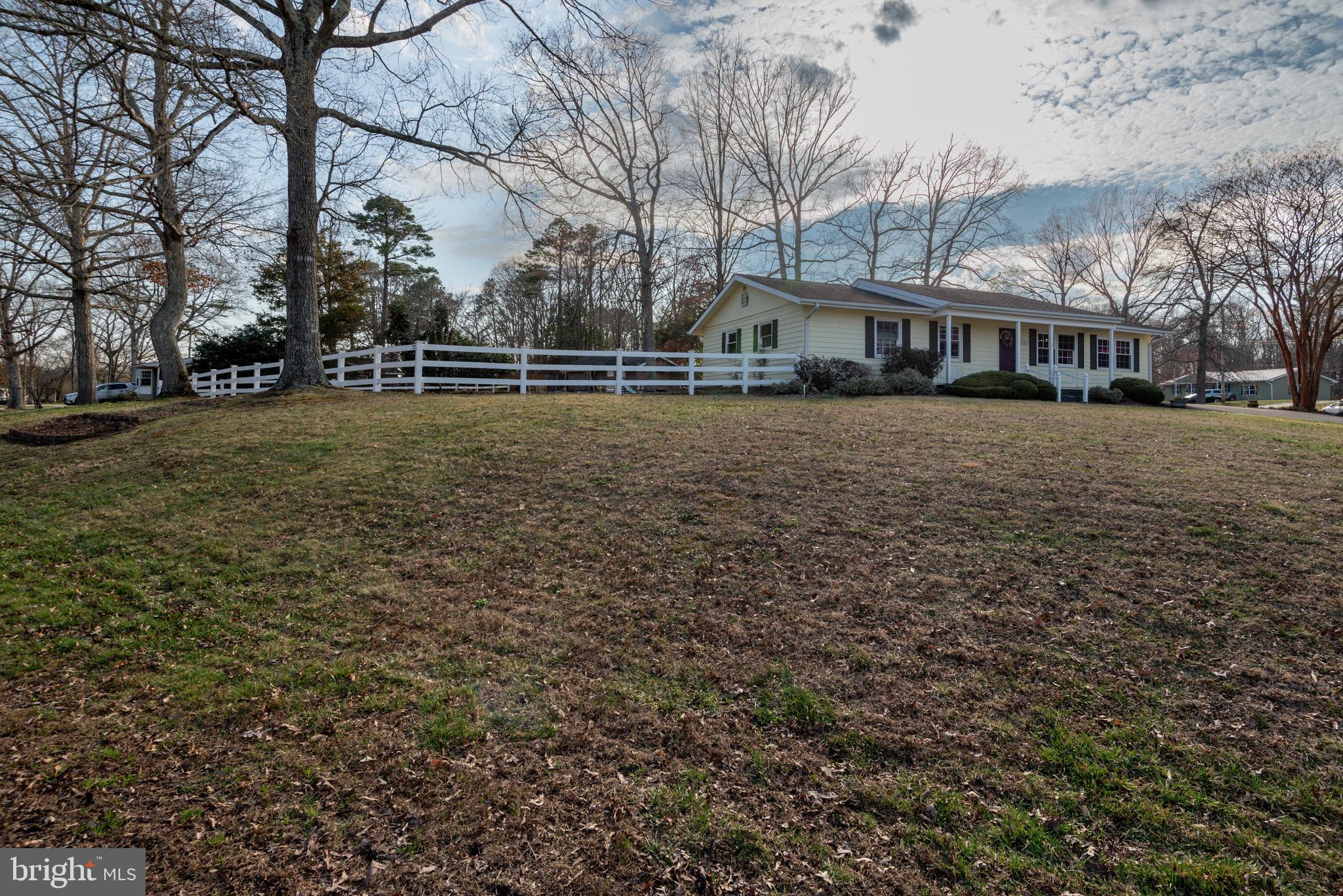 44125 Louisdale Road California, MD 20619 - Photo 25 of 44 a front view of a house with a yard