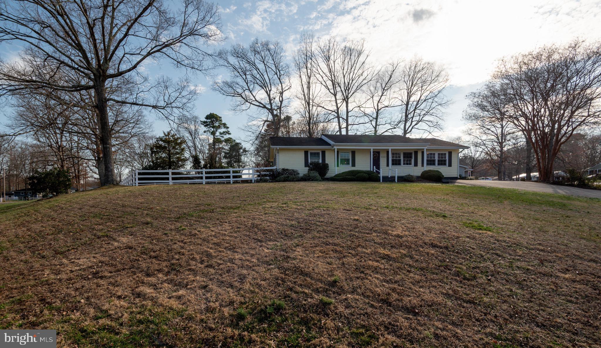 44125 Louisdale Road California, MD 20619 - Photo 26 of 44 a view of house with yard and trees in the background