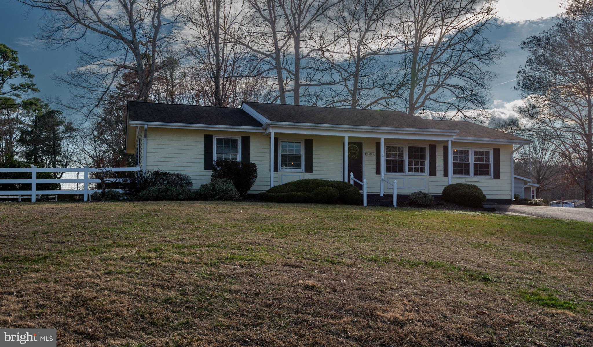44125 Louisdale Road California, MD 20619 - Photo 27 of 44 a front view of house with yard and trees