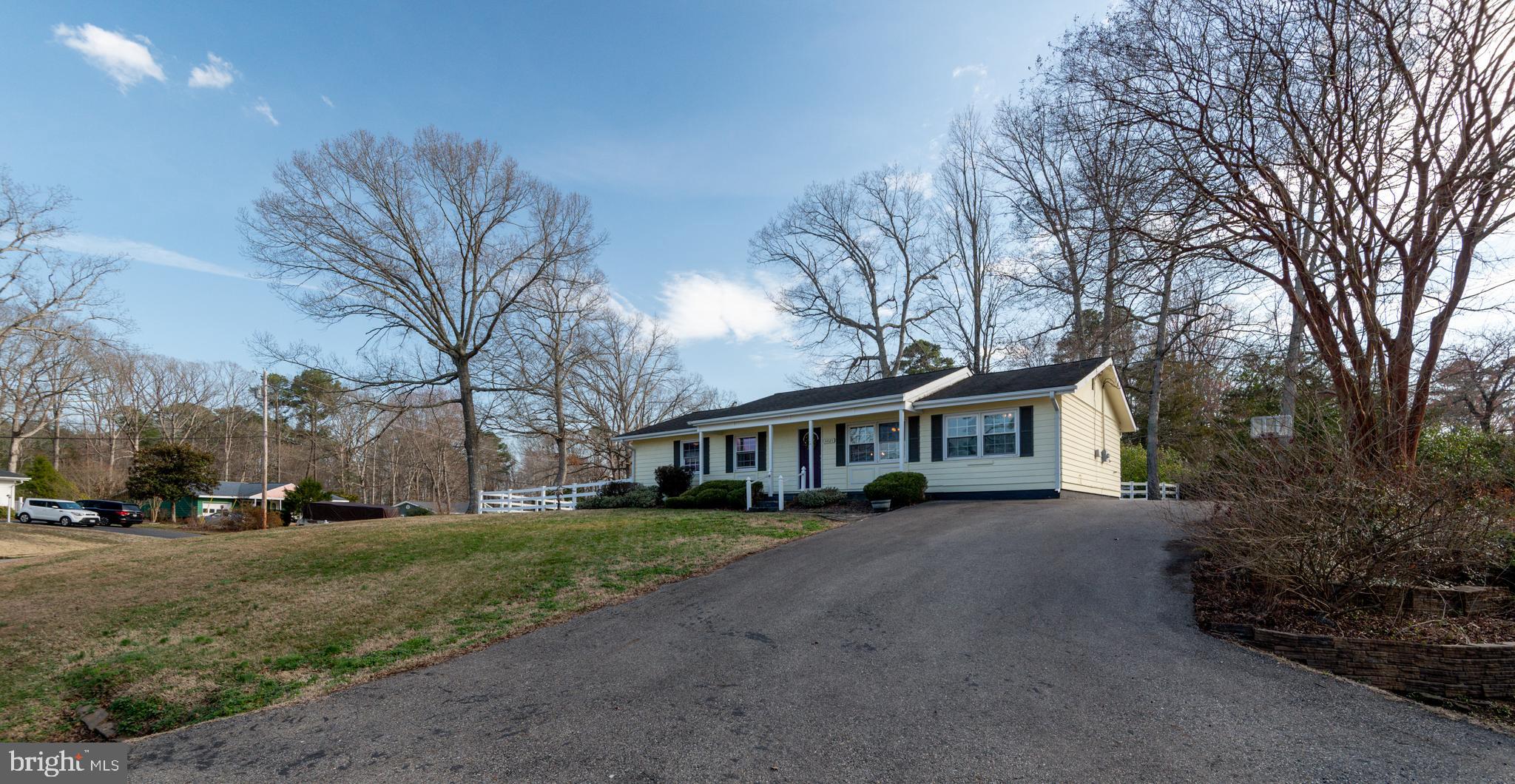 44125 Louisdale Road California, MD 20619 - Photo 28 of 44 a view of a house with a yard covered with snow in the background