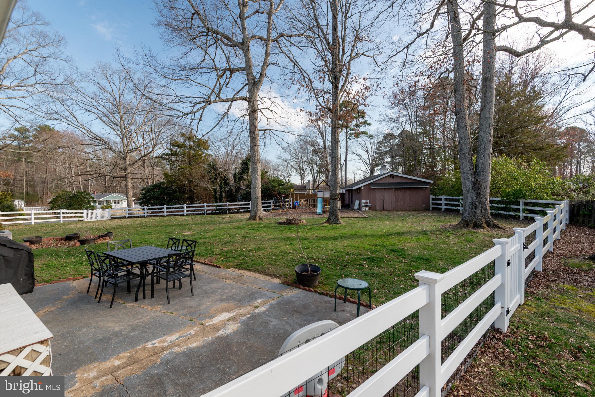 44125 Louisdale Road California, MD 20619 - Photo 34 of 44 a view of a house with backyard and sitting area