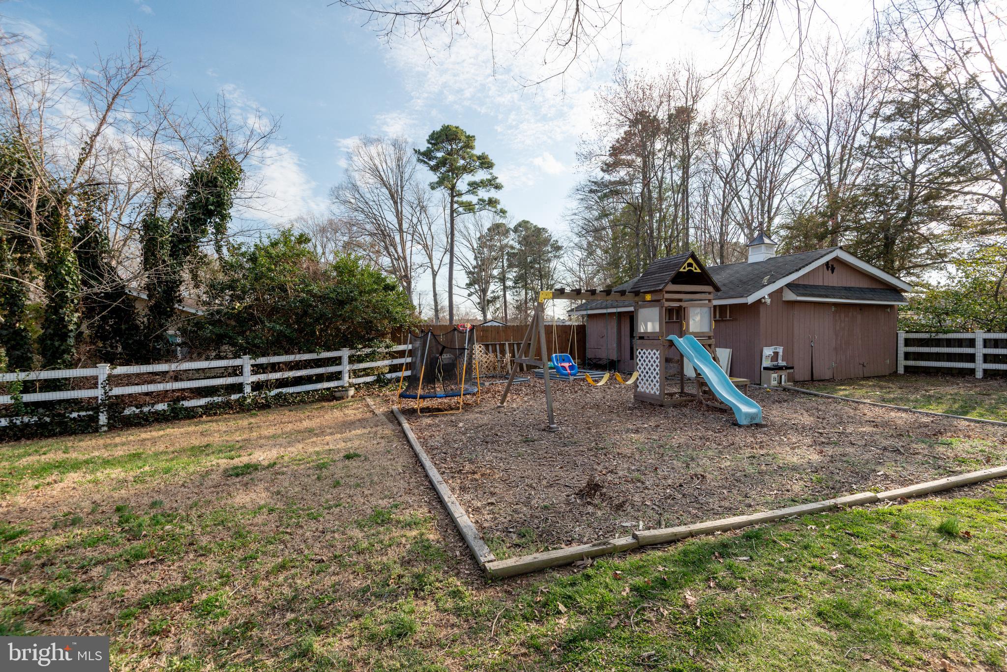 44125 Louisdale Road California, MD 20619 - Photo 42 of 44 a view of a backyard with large trees
