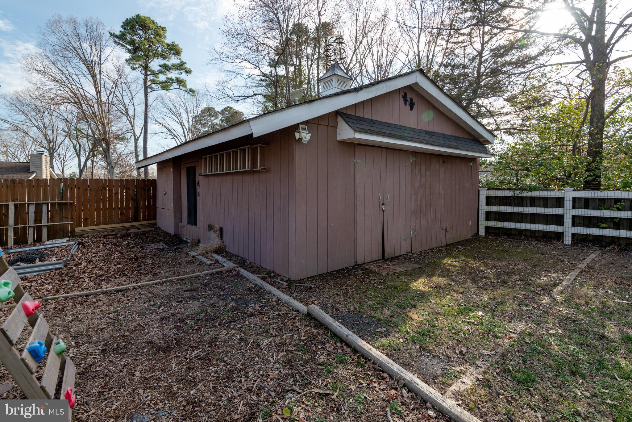44125 Louisdale Road California, MD 20619 - Photo 44 of 44 a backyard of a house with lots of green space