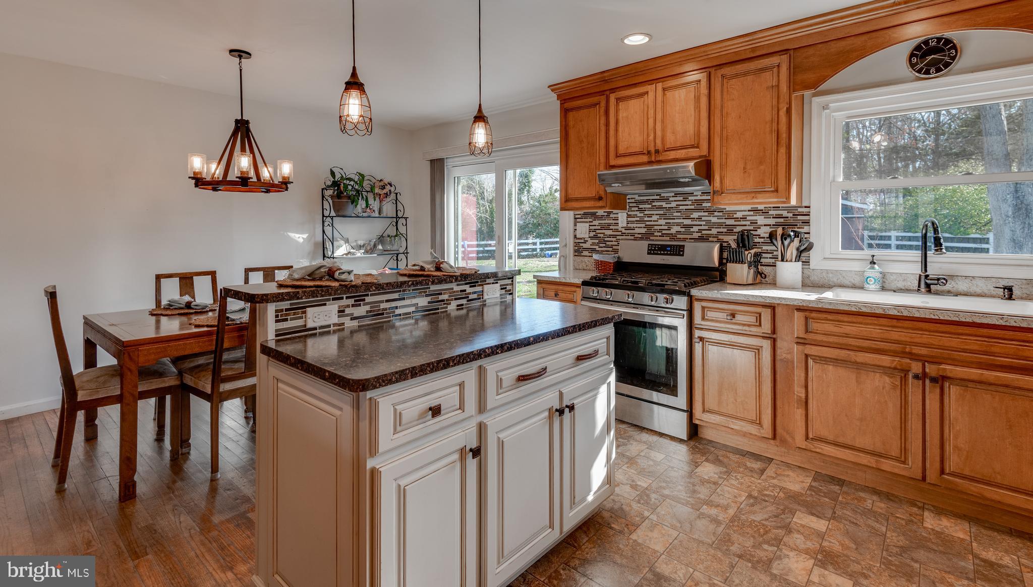 44125 Louisdale Road California, MD 20619 - Photo 5 of 44 a kitchen with stainless steel appliances granite countertop a stove a sink dishwasher and a refrigerator with wooden floor