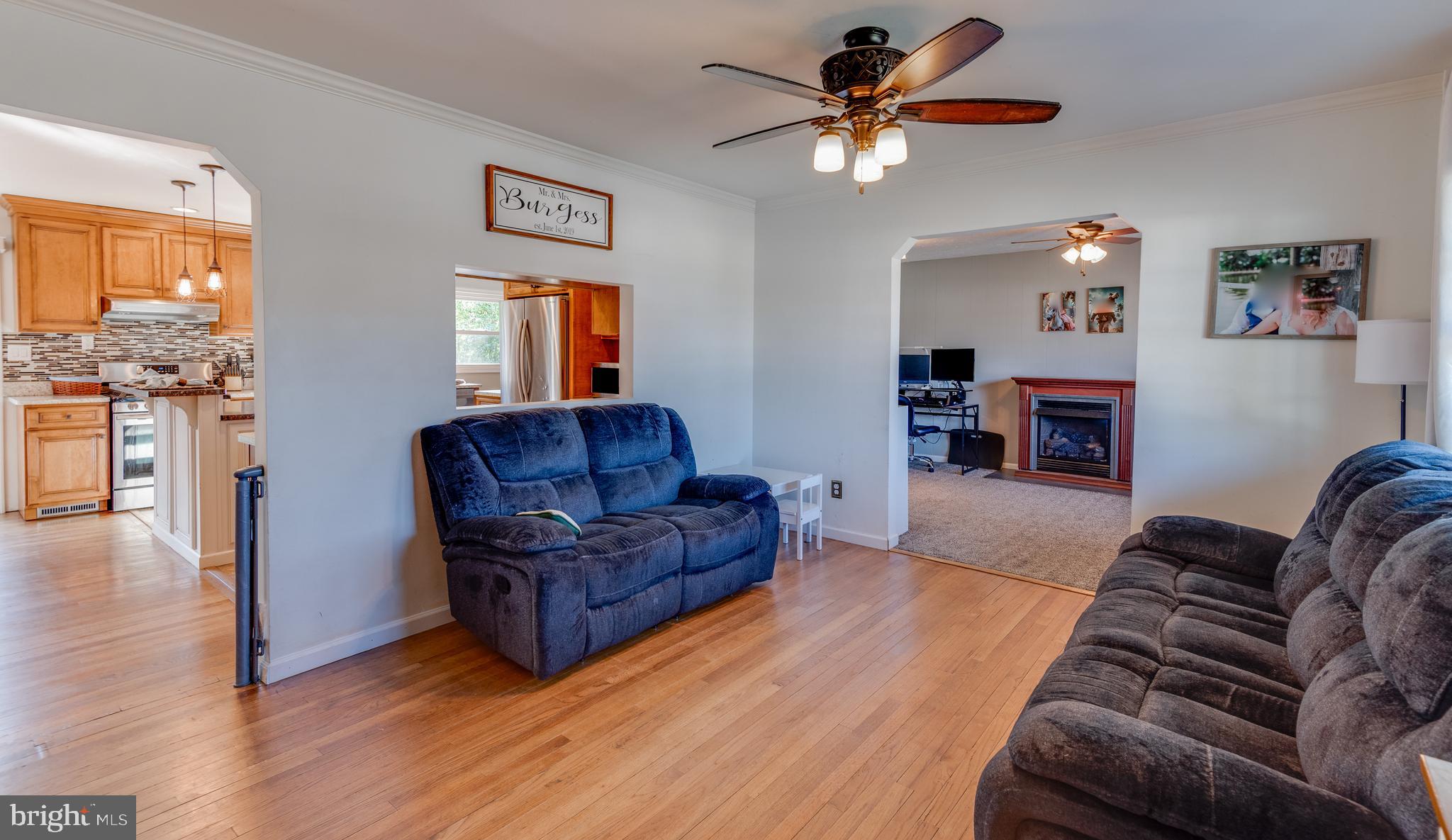 44125 Louisdale Road California, MD 20619 - Photo 8 of 44 a living room with furniture and a chandelier