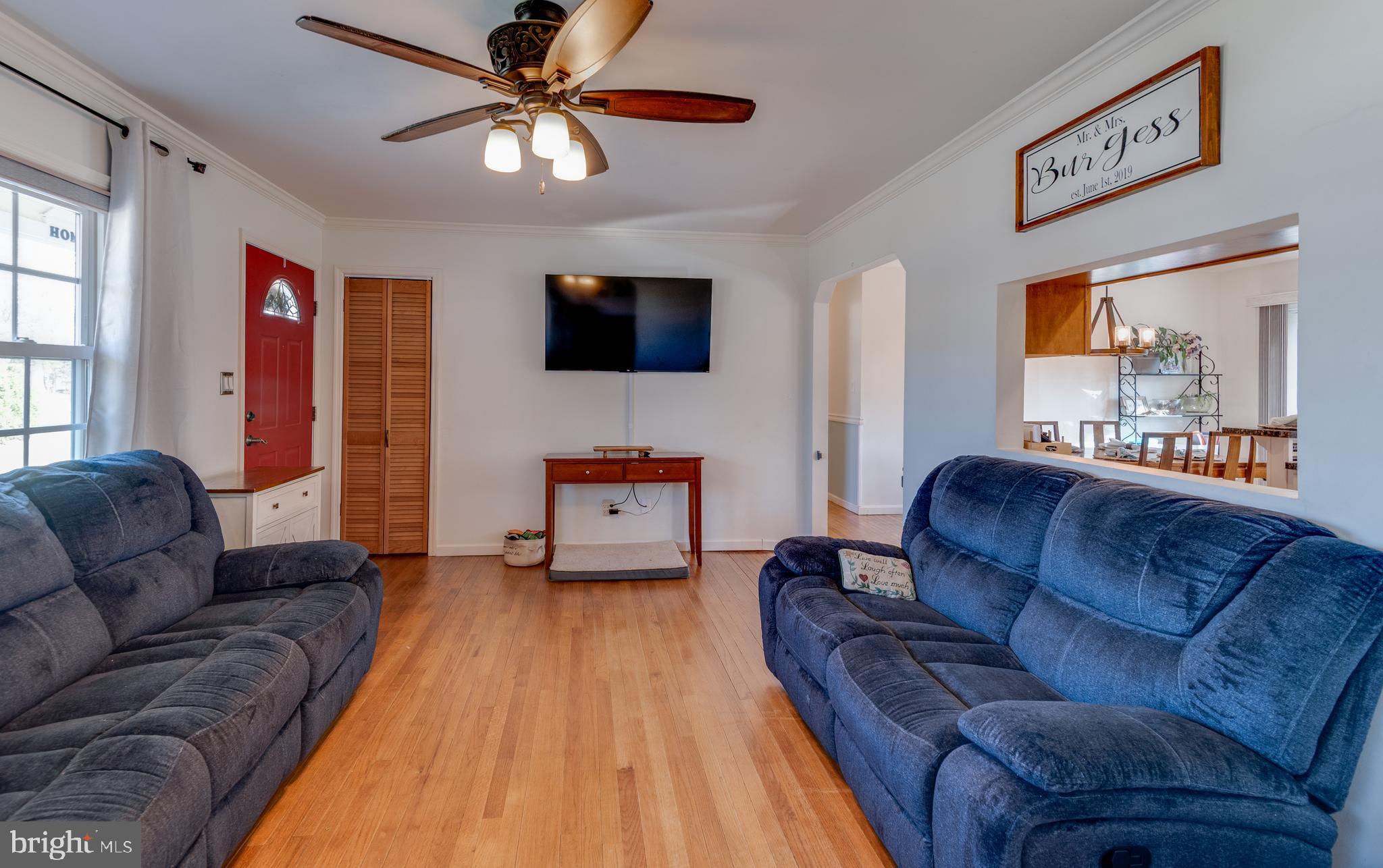 44125 Louisdale Road California, MD 20619 - Photo 9 of 44 a living room with furniture and a flat screen tv