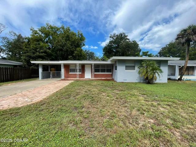 front view of a house with a big yard