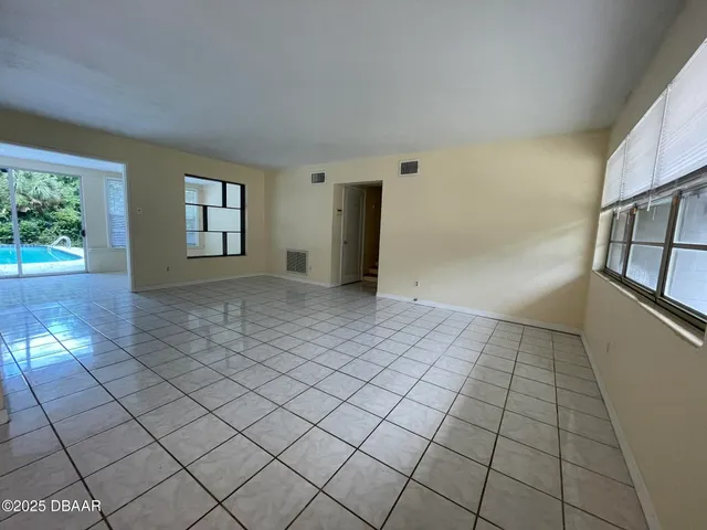 a view of an empty room and window