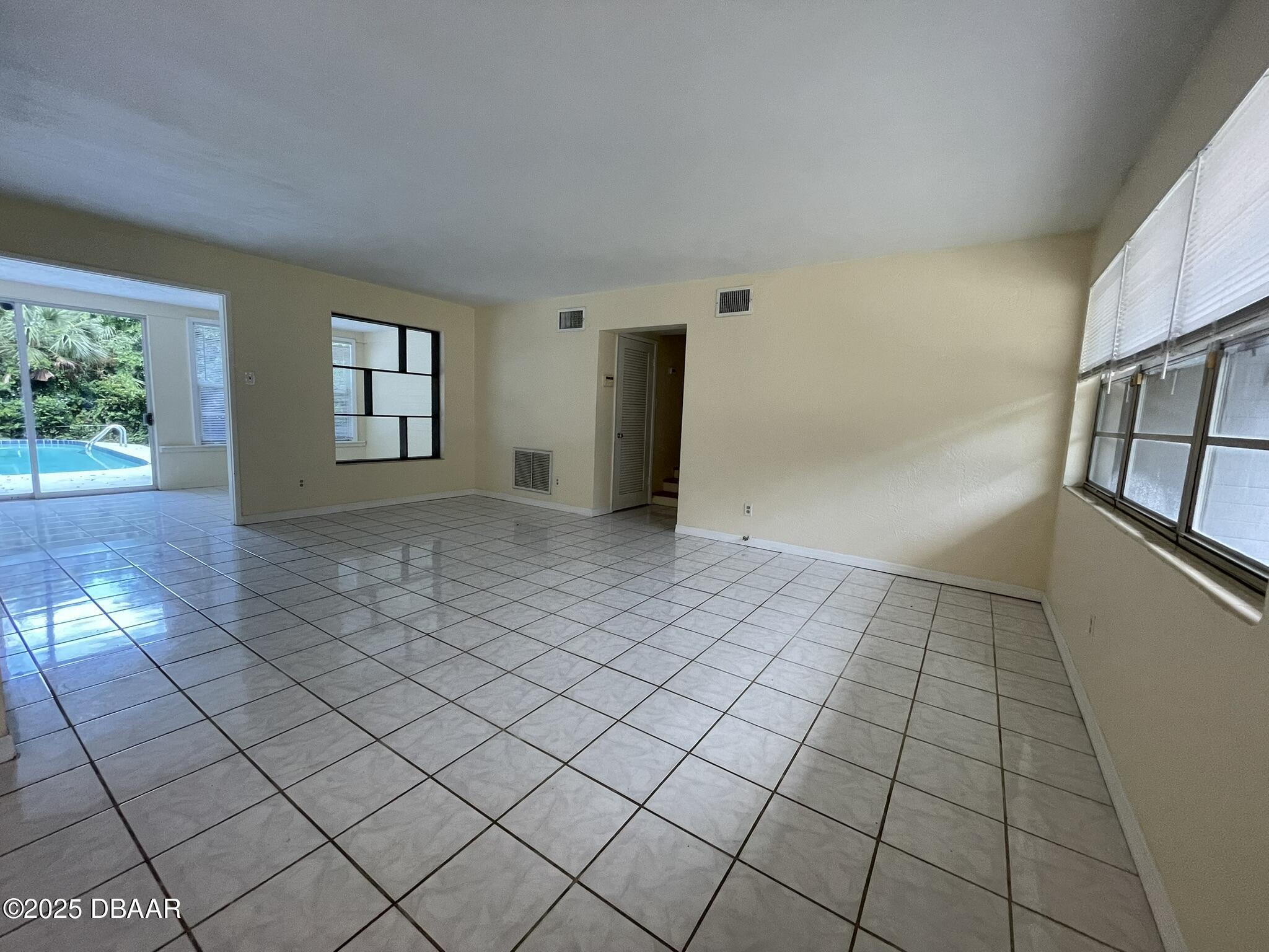 525 Tarragona Way Daytona Beach, FL 32114 - Photo 16 of 47 a view of an empty room and window