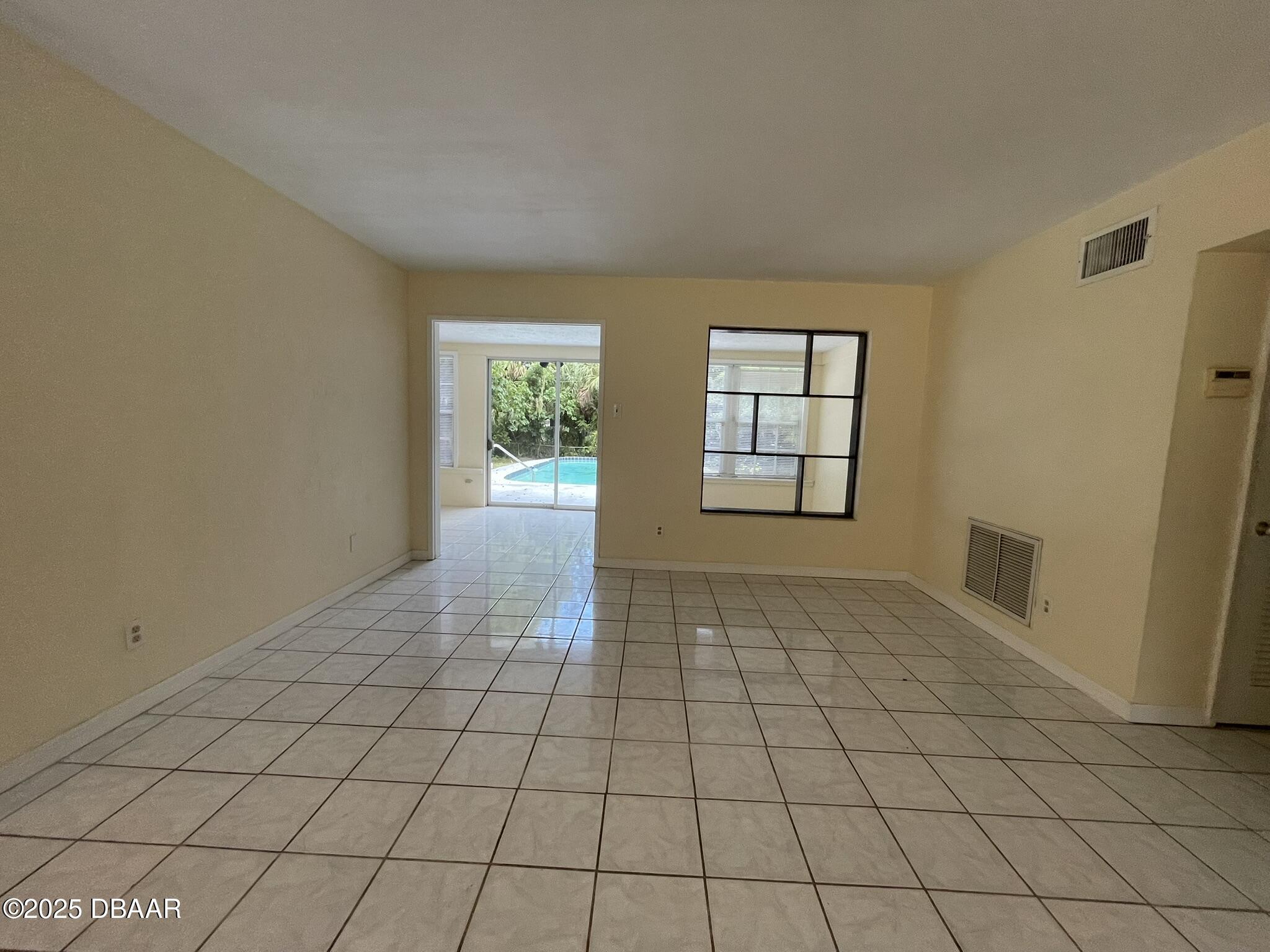 525 Tarragona Way Daytona Beach, FL 32114 - Photo 17 of 47 a view of an empty room and window