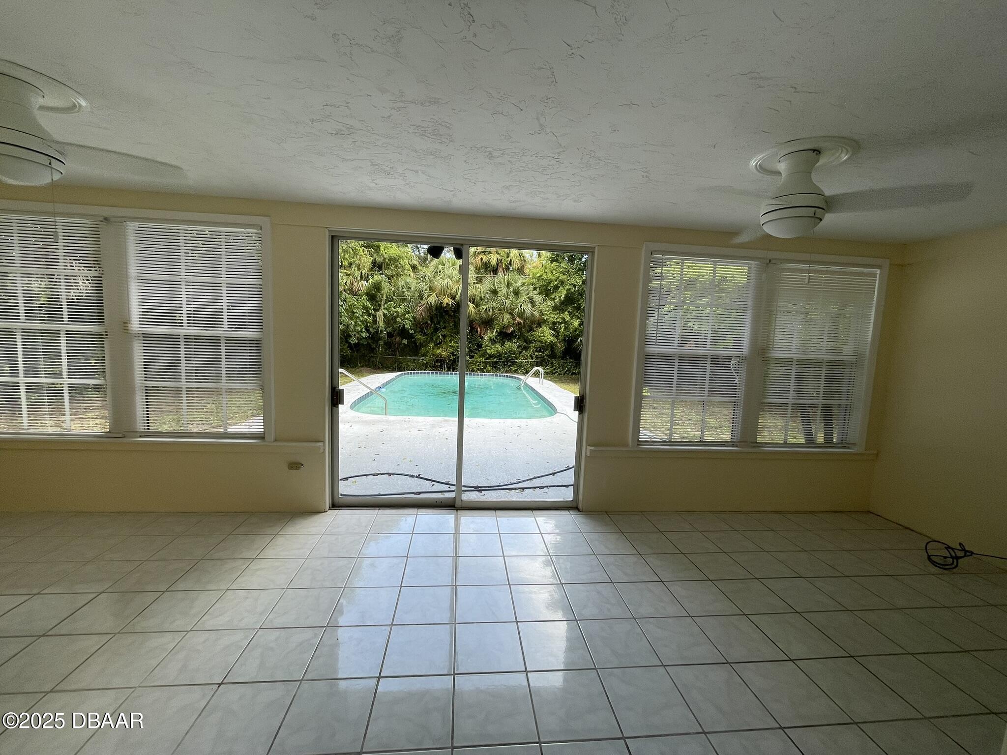 525 Tarragona Way Daytona Beach, FL 32114 - Photo 19 of 47 a room with natural light and window