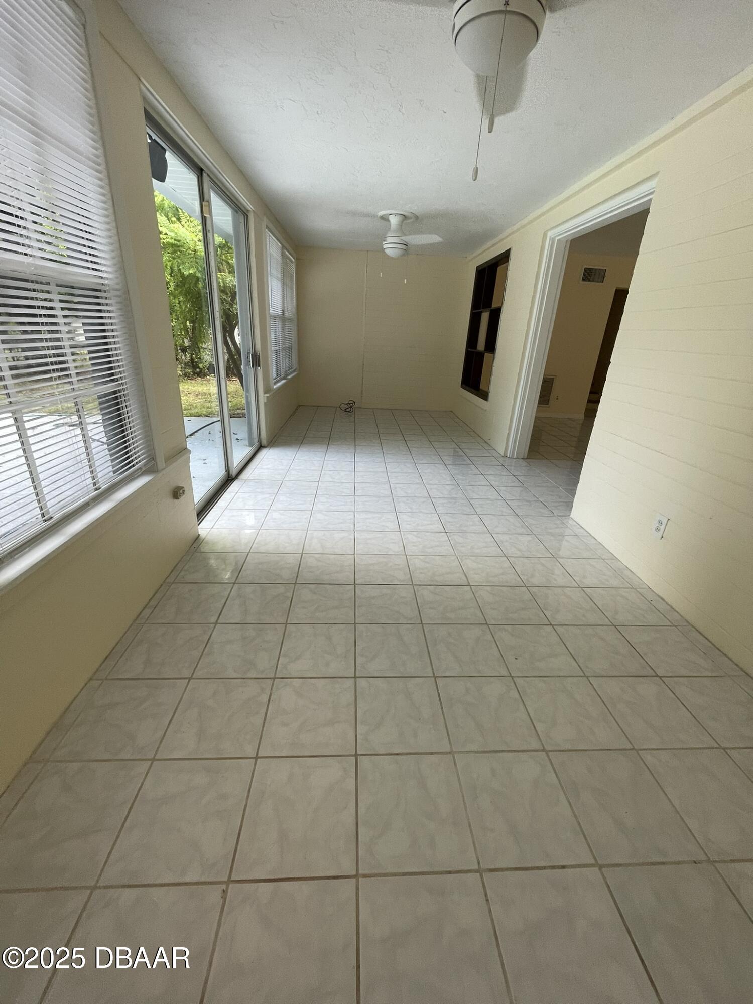 525 Tarragona Way Daytona Beach, FL 32114 - Photo 20 of 47 a view of a livingroom with an empty space and a window