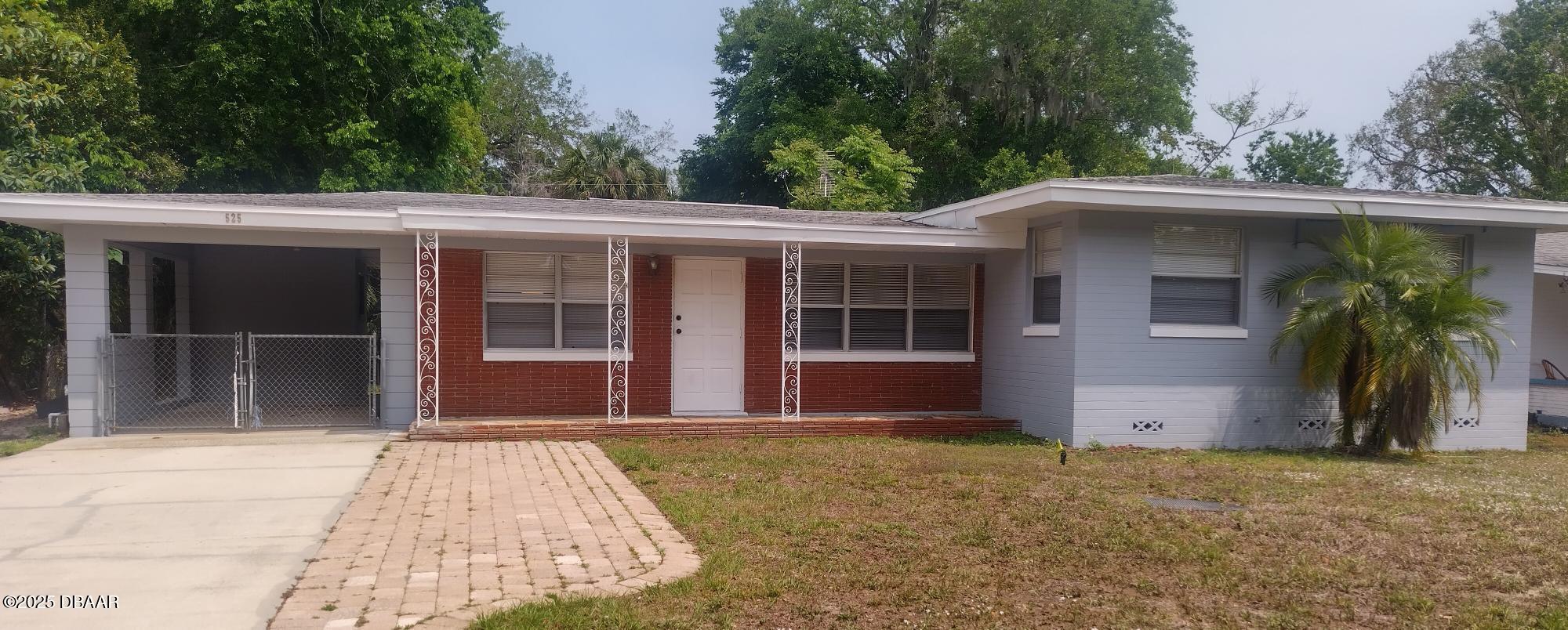 525 Tarragona Way Daytona Beach, FL 32114 - Photo 2 of 47 a front view of house with yard
