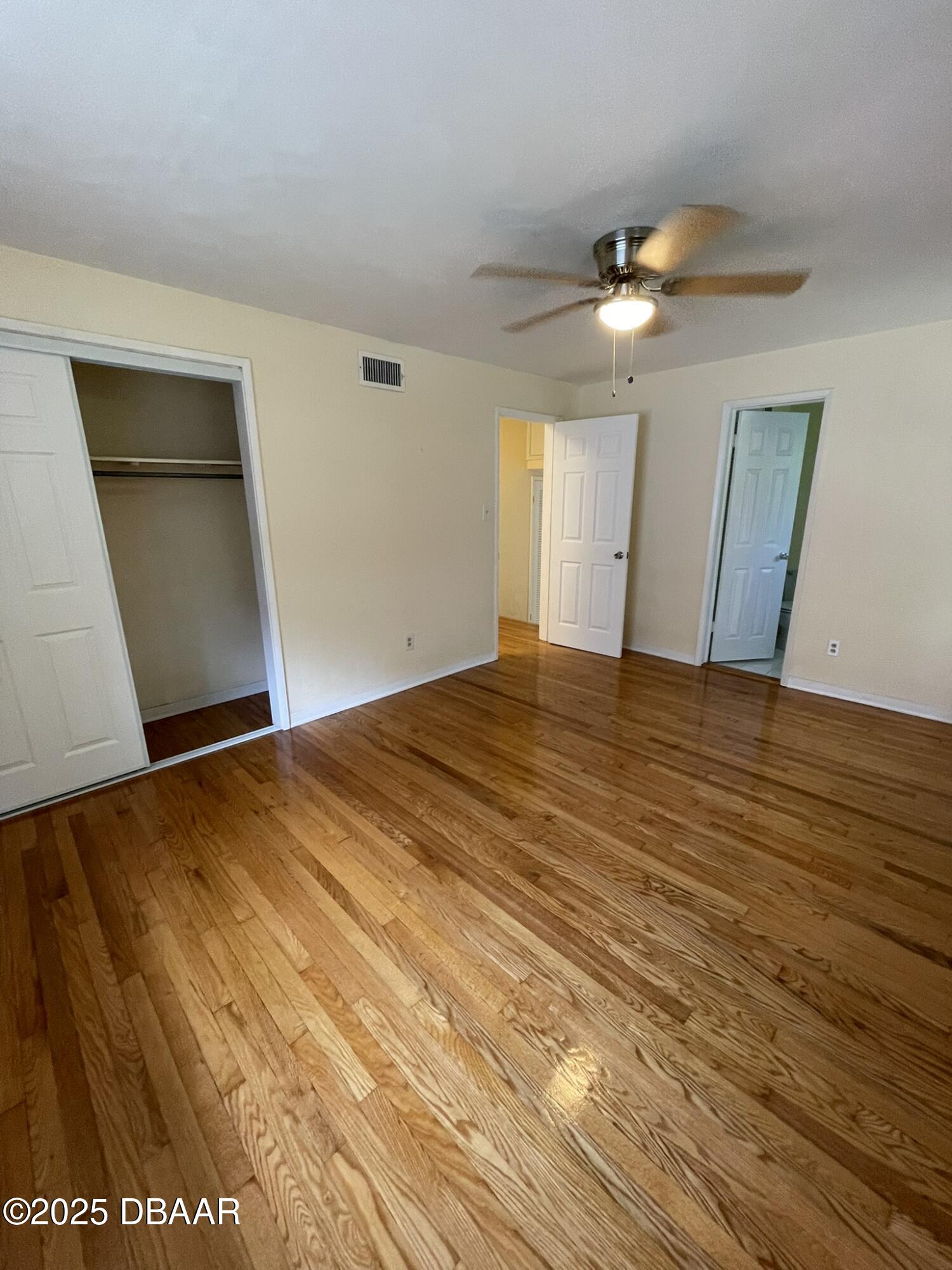 525 Tarragona Way Daytona Beach, FL 32114 - Photo 25 of 47 a view of empty room with wooden floor
