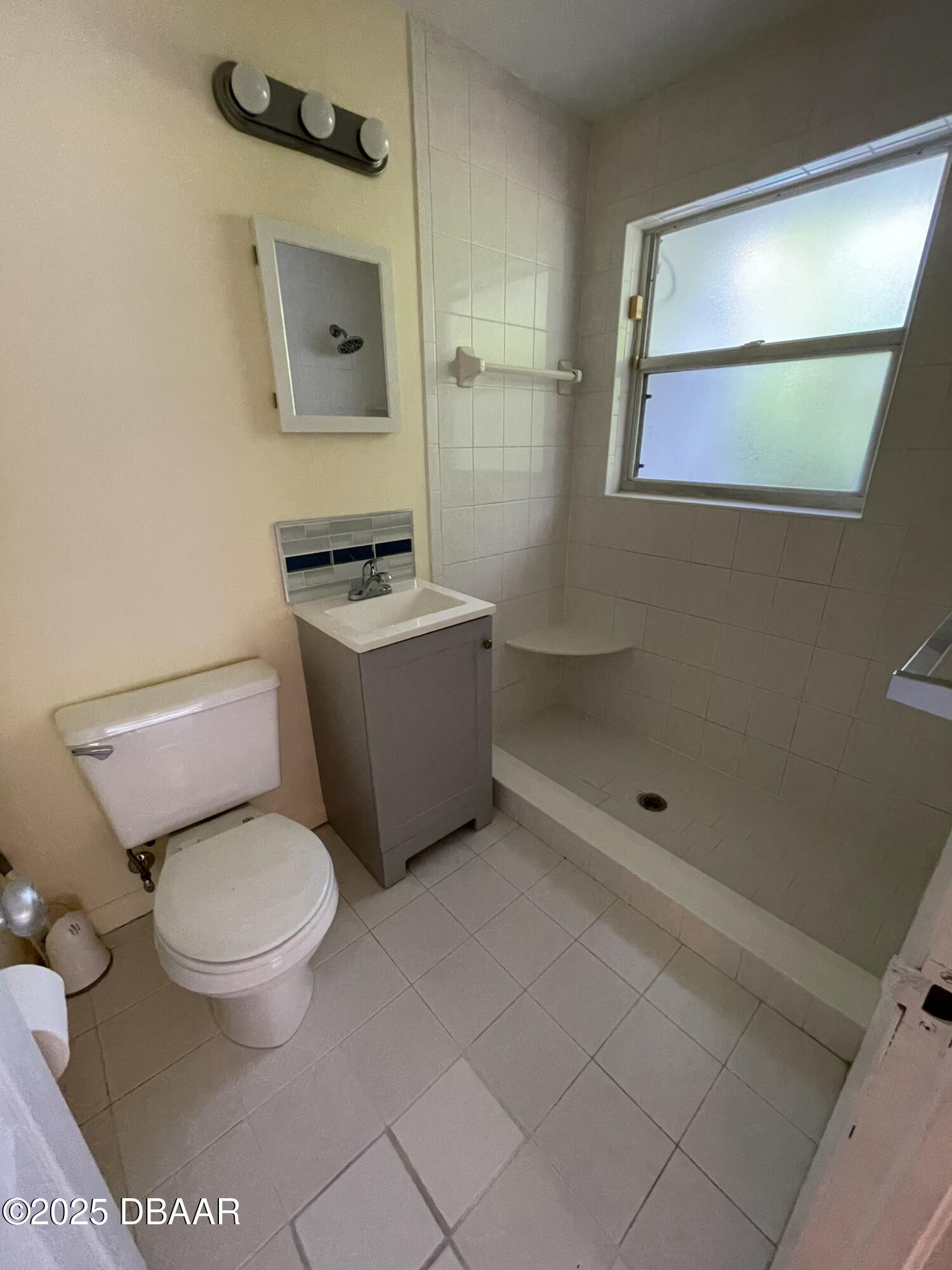 525 Tarragona Way Daytona Beach, FL 32114 - Photo 26 of 47 a white toilet sitting next to a bathroom sink