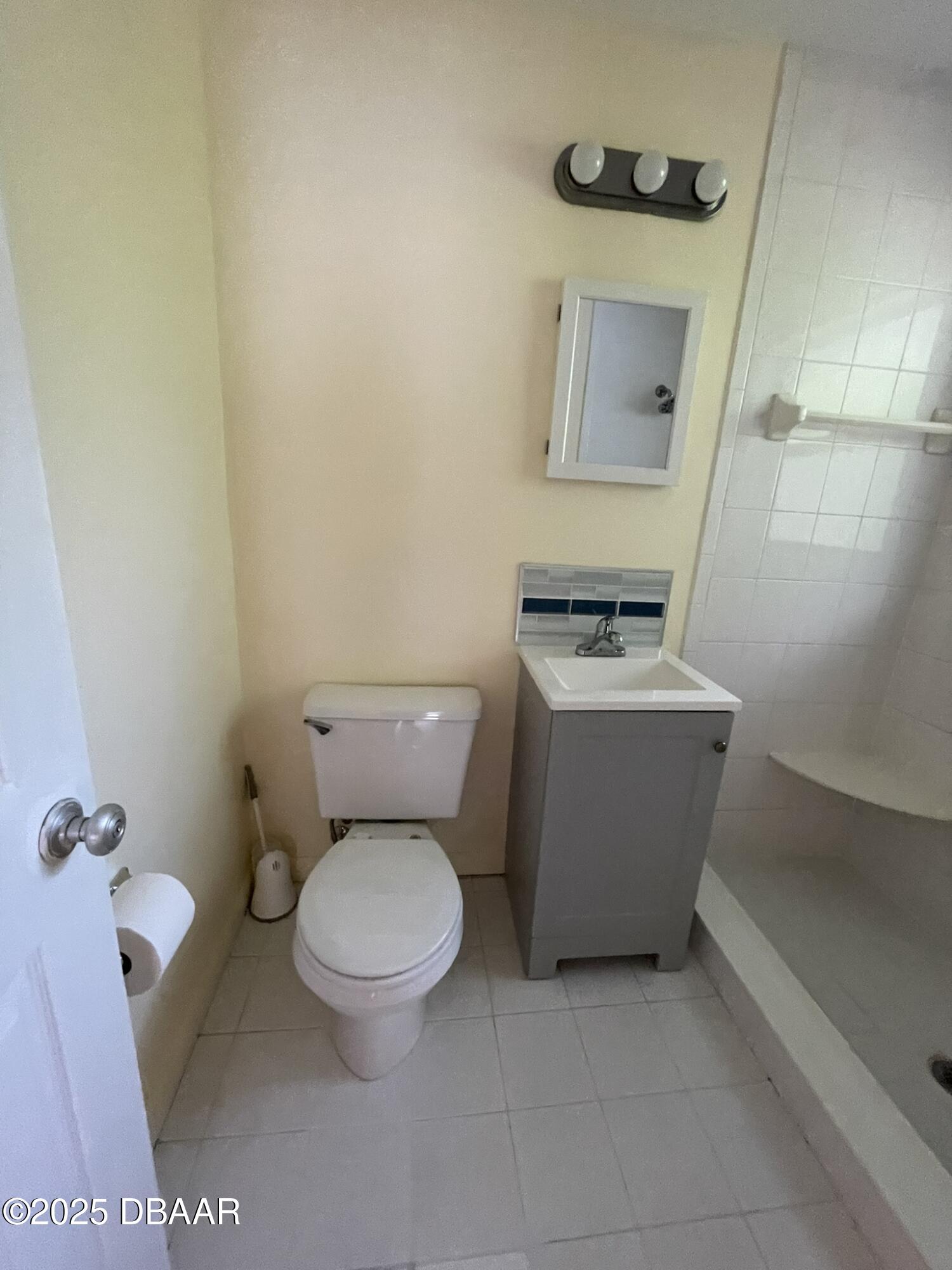 525 Tarragona Way Daytona Beach, FL 32114 - Photo 27 of 47 a white toilet sitting next to a bathroom sink