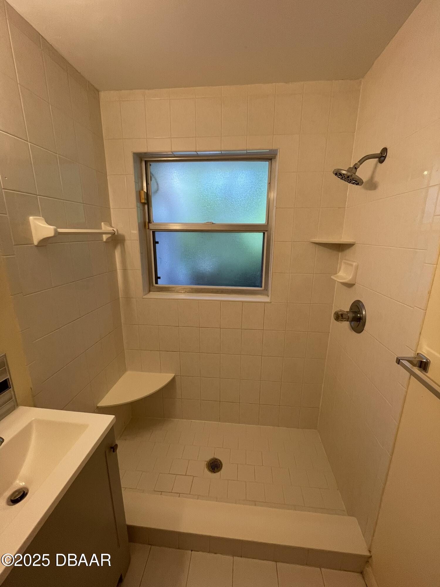 525 Tarragona Way Daytona Beach, FL 32114 - Photo 33 of 47 a bathroom with a shower and a sink