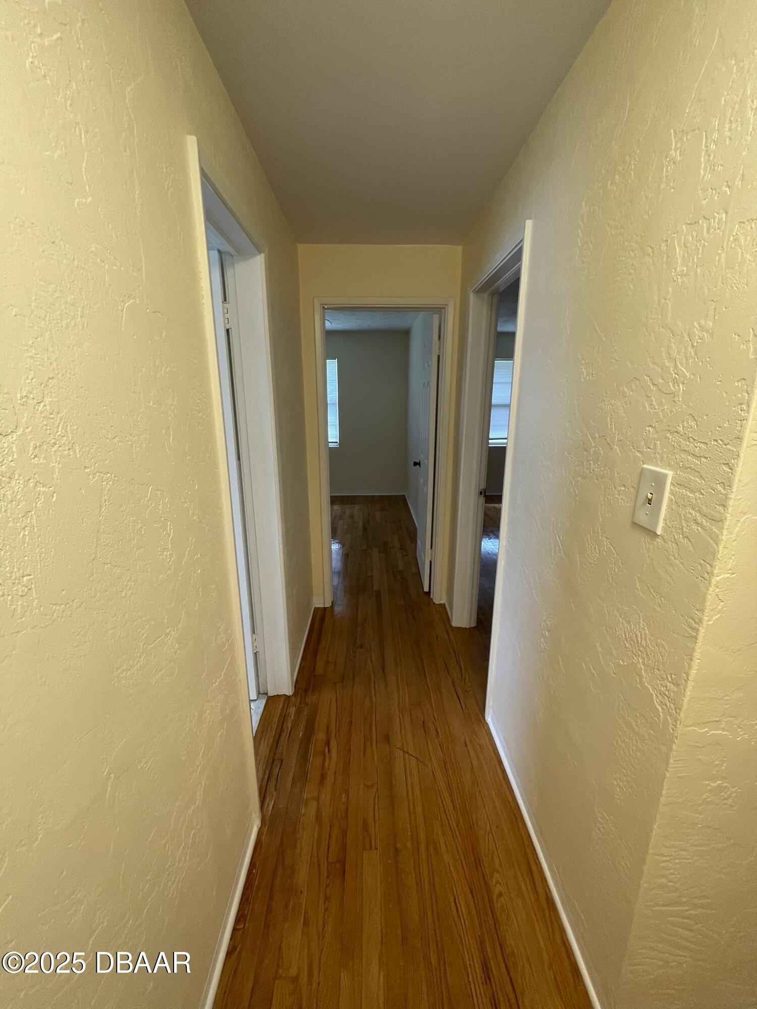 525 Tarragona Way Daytona Beach, FL 32114 - Photo 34 of 47 a view of a hallway with wooden floor