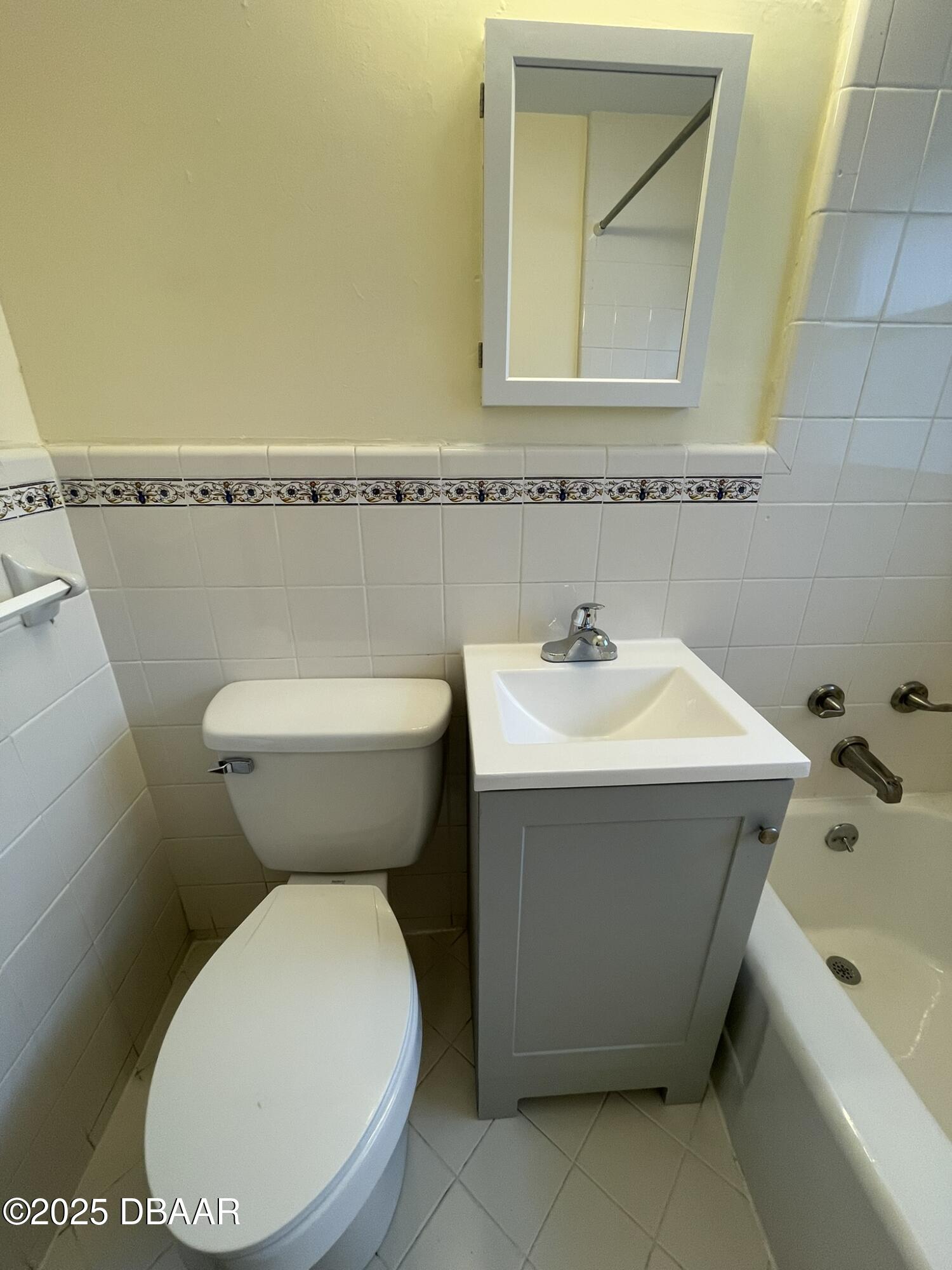 525 Tarragona Way Daytona Beach, FL 32114 - Photo 37 of 47 a bathroom with a toilet sink and mirror